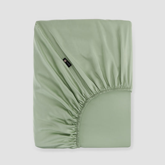 Lençol de baixo ajustável verde bambu by Momo Cotton – tecido de cetim 300 fios, suave, respirável e sustentável.