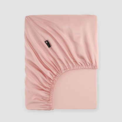 Lençol de baixo ajustável rosa bambu by Momo Cotton – tecido de cetim 300 fios, suave, respirável e sustentável.