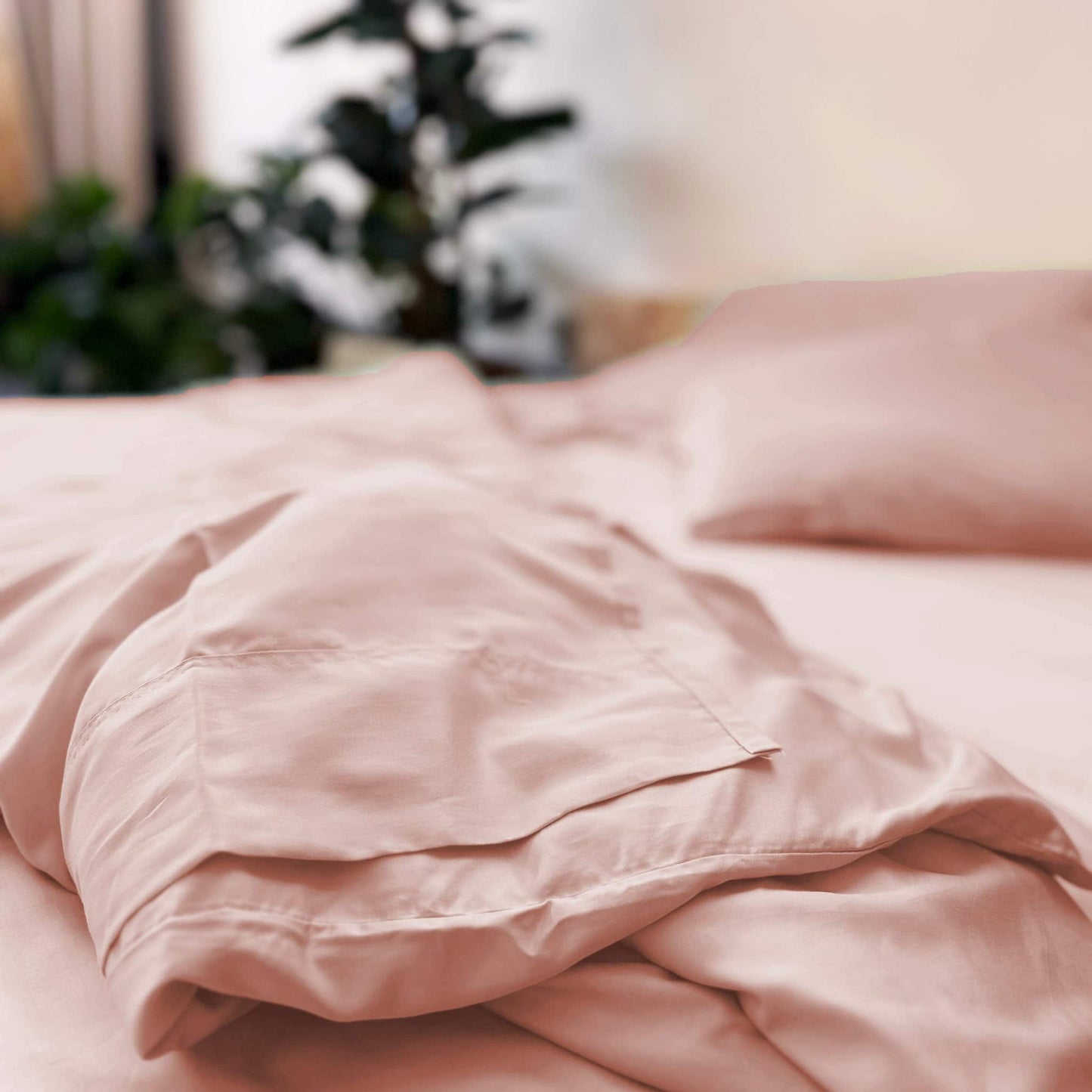Close-up of pink bamboo bedding set – duvet, sheets and pillows, soft, breathable and sustainable