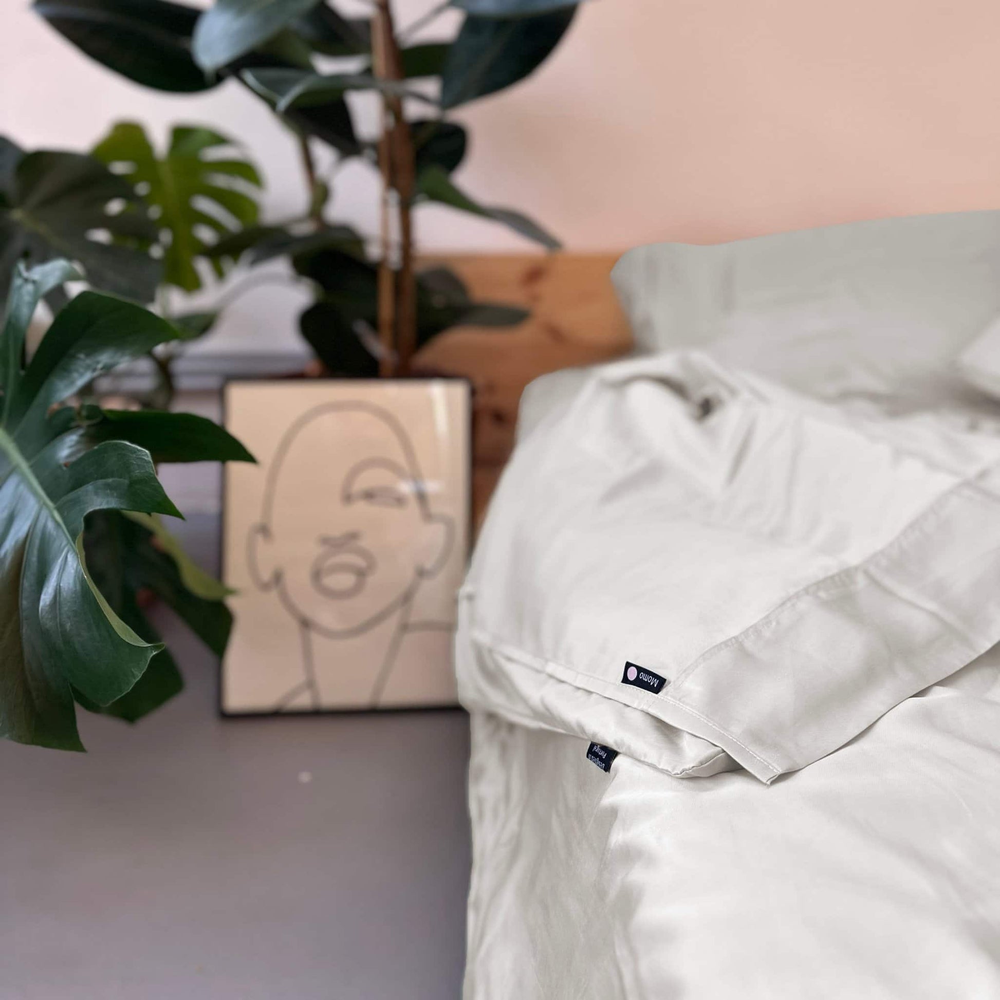Close-up of complete white bamboo bedding set – duvet, sheets and pillows, soft, breathable and sustainable